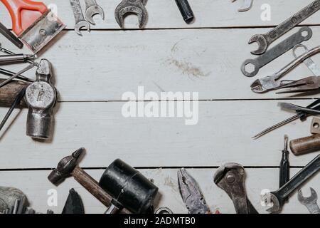 construction hammers screwdriver repair tool pliers on the board Stock Photo