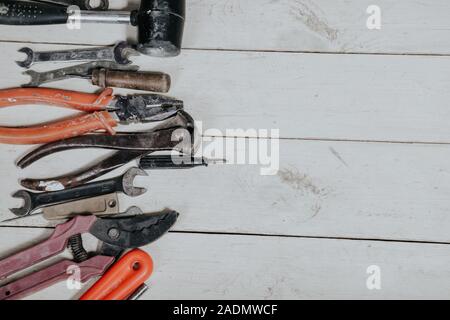 tools for repairs lies on the white boards Stock Photo