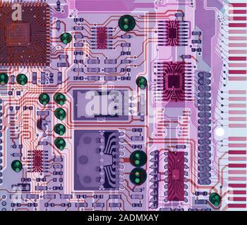 Sound card. Coloured X-ray of part of a sound card (or sound board), a printed circuit board. Among the electronic components attached to it are micro Stock Photo