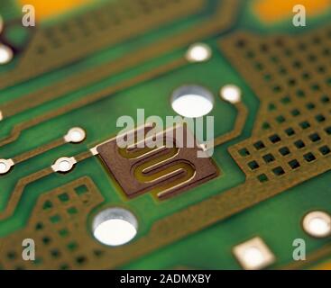 Circuit board. Surface of a printed circuit board (PCB). It consists of a pattern of metal conductors on an insulating material. Electronic components Stock Photo