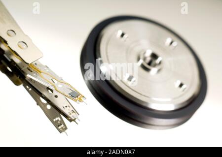 Computer hard disk read/write head. This mechanism reads from and writes to a computer hard drive. Stock Photo