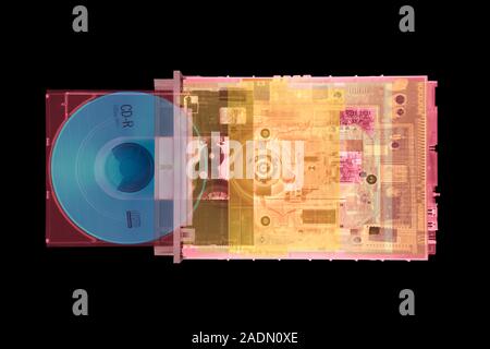 CD drive. Coloured X-ray of a compact disc (CD) drive from a computer. A disc is in the sliding tray at bottom. This will retract into the machine, wh Stock Photo