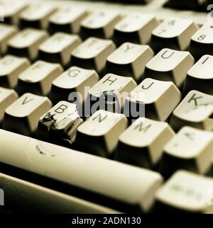 Smashed keyboard. Close-up of broken keys on the keyboard of a computer. Stock Photo