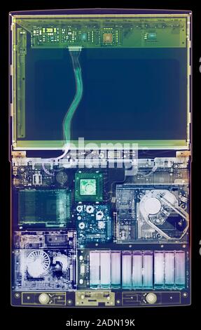 Laptop computer. Coloured X-ray of a laptop computer. The computer's screen is in upper frame (blue). Most of the components are seen in lower frame. Stock Photo