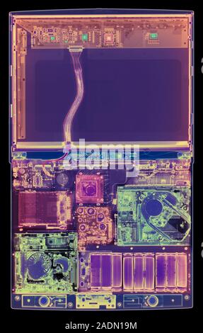 Laptop computer. Coloured X-ray of a laptop computer. The computer's screen is in upper frame (dark blue). Most of the components are seen in lower fr Stock Photo