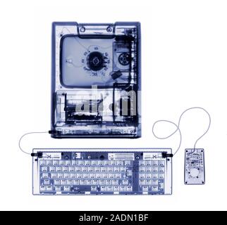 Desktop computer. X-ray of an Apple Macintosh Classic computer. The computer's screen (top centre), hard drive and central processing unit (CPU, centr Stock Photo