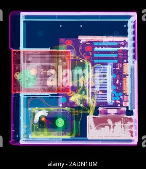 Desktop computer. X-ray of a desktop computer from above. The computer's hard drive (permanent storage, green, lower left), CD-ROM drive (compact disc Stock Photo