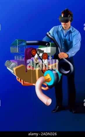 Virtual reality engine. Engineer working on a virtual reality (VR) car engine. The engineer is wearing a headset which provides images and sounds of t Stock Photo