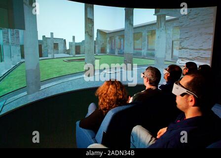 Virtual reality archaeology. Spectators using goggles to view a virtual reality recreation of a Roman building in Pompeii. This is the House of the Ce Stock Photo