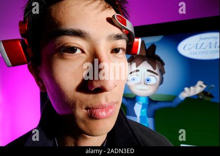 MindSet brainwave-reading headset. Person wearing a Mindset brain-computer interface (BCI) headset developed by Neurosky Inc., San Jose, USA. The head Stock Photo
