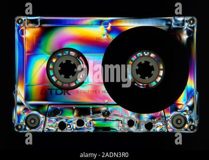 Stress patterns in an audio tape cassette with a clear plastic case, revealed by photopolarimetry. When plastic objects are manufactured, internal str Stock Photo