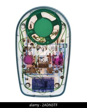 Radio. Coloured X-ray of a portable radio showing its electronic components. The radio receives radio waves transmitted from a radio station and conve Stock Photo