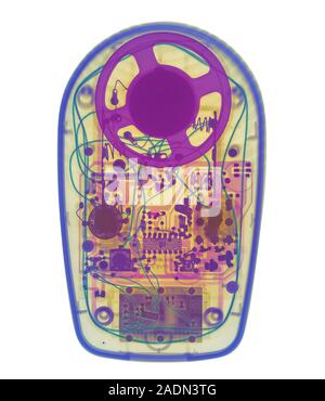 Radio. Coloured X-ray of a portable radio showing its electronic components. The radio receives radio waves transmitted from a radio station and conve Stock Photo