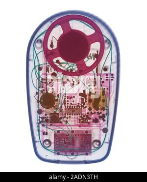Radio. Coloured X-ray of a portable radio showing its electronic components. The radio receives radio waves transmitted from a radio station and conve Stock Photo