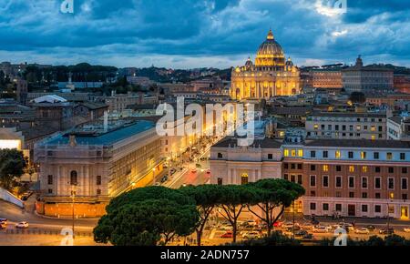 Panoramic night sight in Rome with Saint Peters Basilica, as seen from the Castel Sant'Angelo terrace. Stock Photo