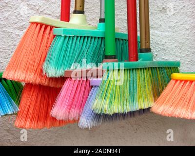 Recycled plastic brooms. Stock Photo