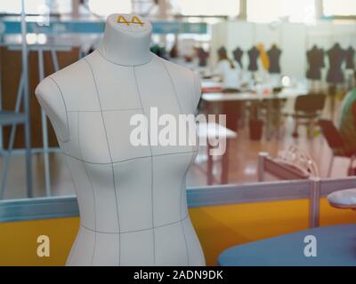 Interior of garment factory . Closes making atelier with several sewing machines. Tailoring industry, fashion designer workshop, industry concept Stock Photo