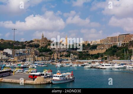 Yachts, boats and ships in Mgarr harbour, at Gozo island Stock Photo