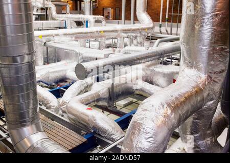 Clean room ventilation apparatus. Ventilation pipes being used to maintain and circulate clean air in a clean room facility. Clean room facilities are Stock Photo