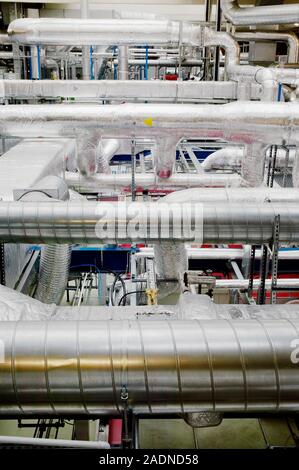 Clean room ventilation apparatus. Ventilation pipes being used to maintain and circulate clean air in a clean room facility. Clean room facilities are Stock Photo