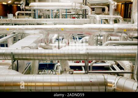 Clean room ventilation apparatus. Ventilation pipes being used to maintain and circulate clean air in a clean room facility. Clean room facilities are Stock Photo