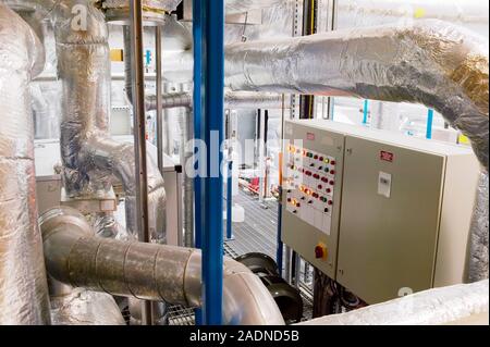 Clean room ventilation apparatus. Control panel and ventilation pipes for a system being used to maintain and circulate clean air in a clean room faci Stock Photo