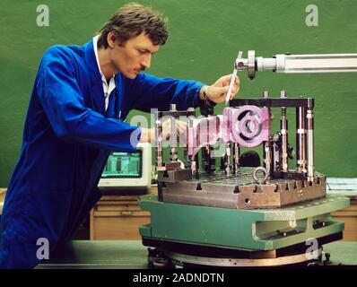 Mechanical engineering. Technician performing a quality control test on a machine part. Photographed in Germany. Stock Photo