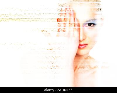 MODEL RELEASED. Face recognition. Woman's face being broken up into packets of data, representing the identification of facial features by a biometric Stock Photo