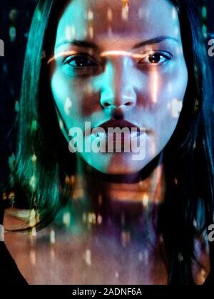 Face recognition. Conceptual image of a biometric security system represented by a woman.s face being scanned. Stock Photo