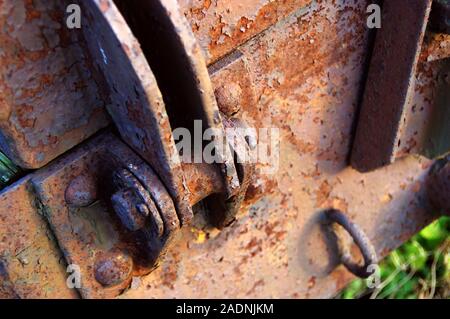 Old rusty link. Damaged and rough hinge mechanism. Stock Photo