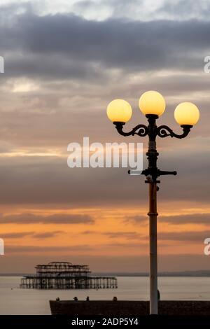 old style lights and pier at sunset Stock Photo