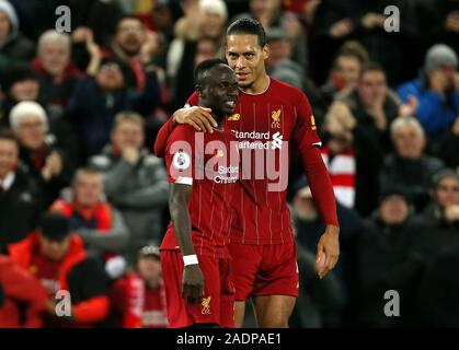 Liverpool's Sadio Mane (left) celebrates scoring his side's fourth goal of the game with team-mate Virgil van Dijk during the Premier League match at Anfield, Liverpool. Stock Photo