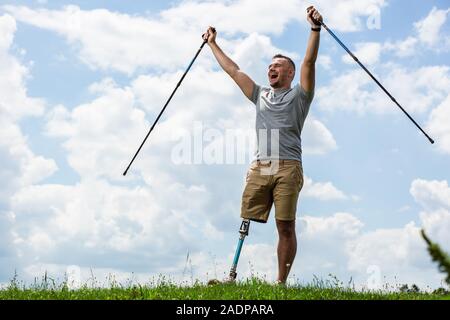Elated young man with disability feeling happy Stock Photo