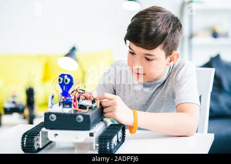 Smart schoolboy being involved in engineering classes Stock Photo