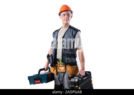 Builder with tools in cases. In a helmet and glasses, and unloading. Stock Photo