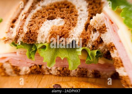 Reuben Sandwich on pumpernickel and rye bread with cookie Stock Photo