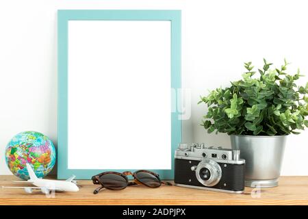 Interior poster mock up with vertical wooden frame, travel theme, on white wall background Stock Photo