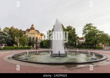 Beautiful and working fountain in the square in the city of Plovdiv, this ancient city located on seven hills in southern Bulgaria. Stock Photo