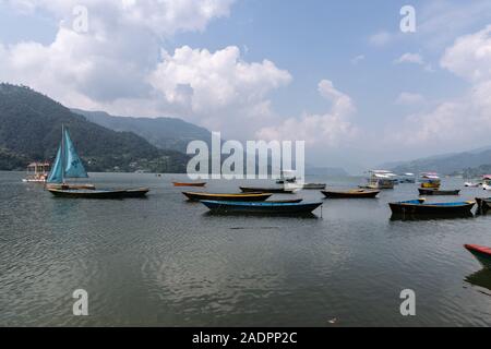 Phewa Lake a Cloudy Day and wooden color Boats Stock Photo