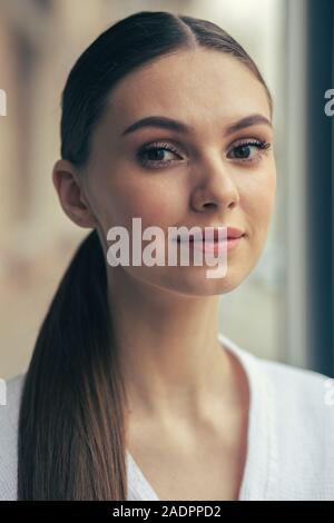 Portrait of the beautiful long haired woman smiling Stock Photo