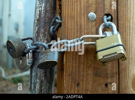 Locks on a private property gate. Stock Photo