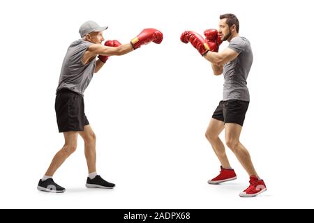 Full length shot of a young man training box with an elderly man isolated on white background Stock Photo