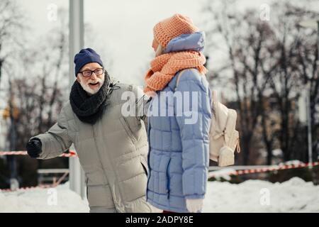 Elderly couple smiling while having fun outdoors Stock Photo