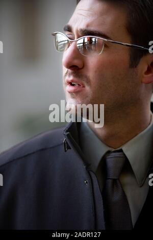 Portrait of a well-dressed businessman standing outside his office building Stock Photo