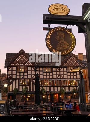 The Old Wellington,half timbered,pub from 1552,scheduled ancient monument,4 Cathedral Gates, Manchester. At dusk, winter time.