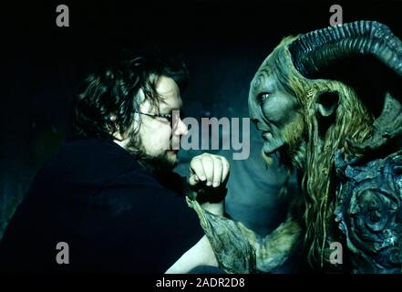 Guillermo del Toro on set with Doug Jones as the Faun in full makeup during the making of Pan's Labyrinth (2006) about a young girl living in Falangist Spain about a girl escapes the horror around her by entering in to a strange fantasy world. Stock Photo