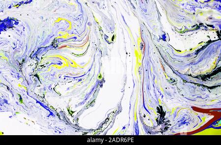 Paint on water. Different color. Background, texture. Close up. Stock Photo
