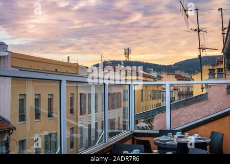 View from a rooftop cafe of antennas and satellite dishes crowding the tops of the historic buildings in the Old town area of Nice, France at disl Stock Photo