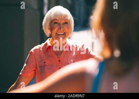 Looking excited when meeting in the street stock photo Stock Photo