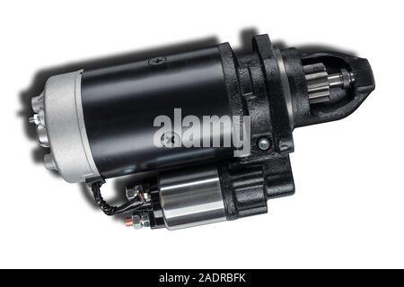 3kW starter motor for tractor or other agricultural machinery placed on white isolated background with shadow. Stock Photo